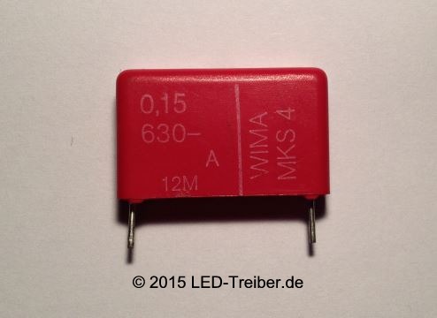roter Kondensator auf weißem Papier, 25W-Glühlampe